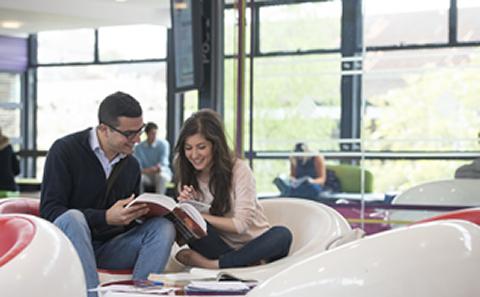 Student in Students Union looking up information