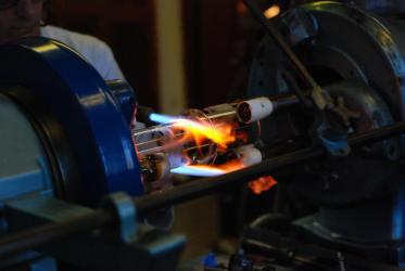 Glassblowing expert creating customised glassware in a workshop