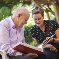 Man and woman looking at a photograph album