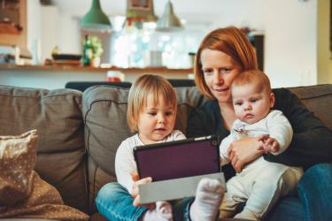 Mum with children using a tablet